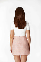 The perfect A-line shape of our PRIMANELK powder pink bouclé skirt.